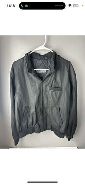 Members Only black zip-front jacket with rib knit collar and cuffs